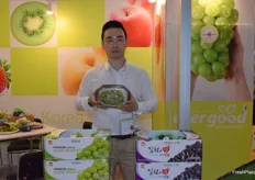 Evergood corporation supplies a wide variety of South Korean fruits including grapes, strawberries, peaches and apples. Mr Kim is presenting the company at the booth.